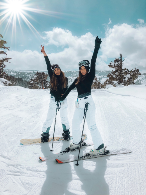 Two Girls on Mountain Skiing