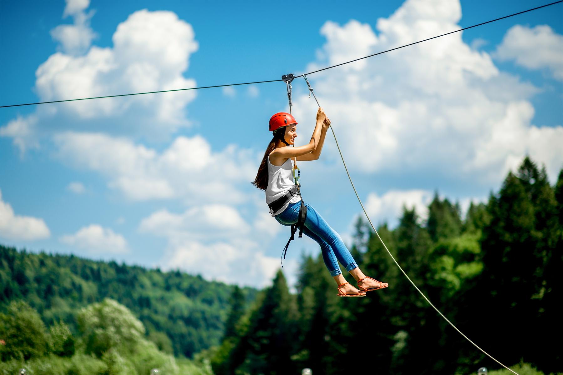 Woman Ziplineing in Big Sky Montana