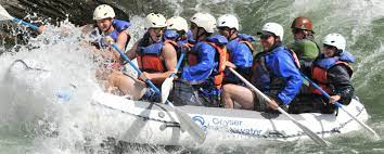 Group of People White Water Rafting
