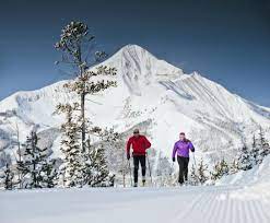 Couple Nordic Skiing with Lone Peak in Background