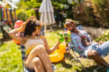 People in Backyard Enjoying Staycation