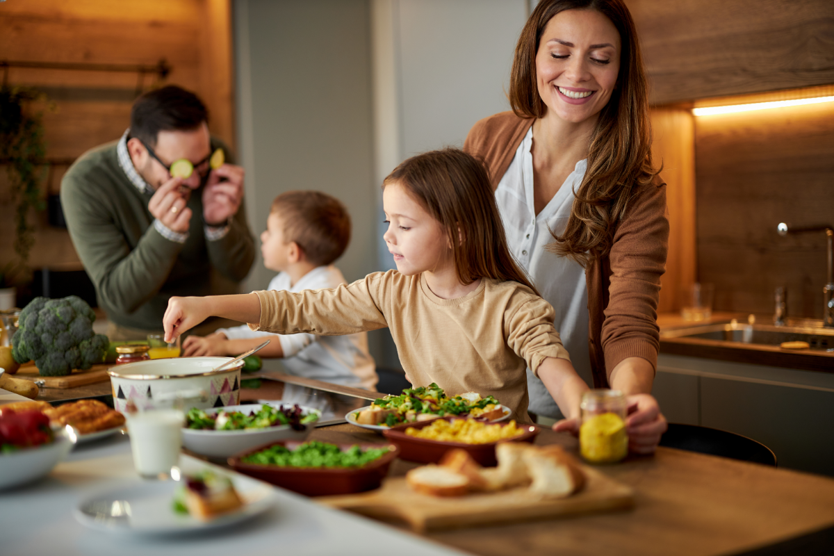 Family in Kitchen Cooking Together