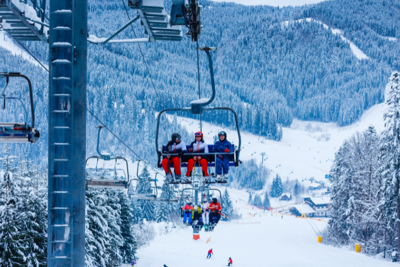 People on Ski Lift in Winter